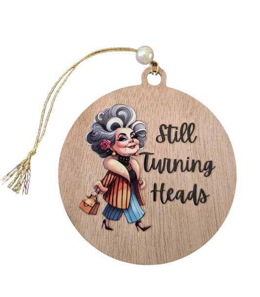Still turning heads small hanging sign