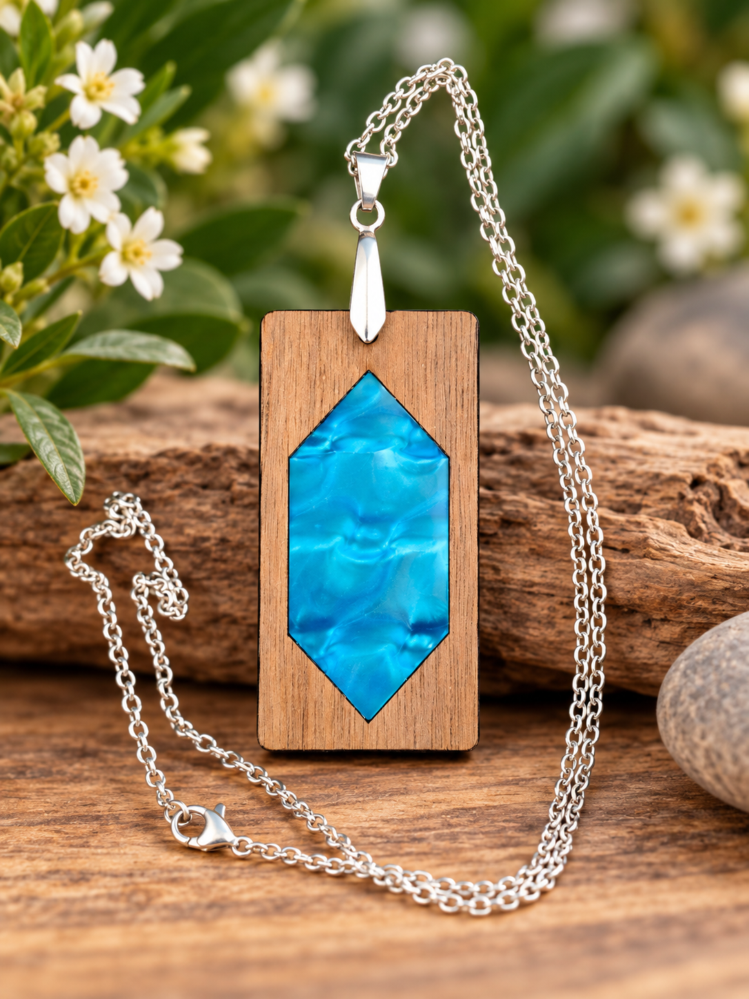 Mermaid Reef walnut and blue patterned acrylic pendant necklace with silver-tone chain, handcrafted and laser cut in New Zealand by Dopey Dog NZ.