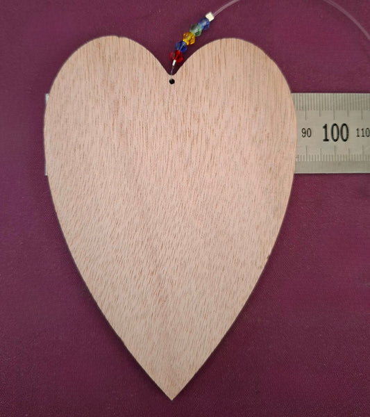 Hanging wooden heart with flowers