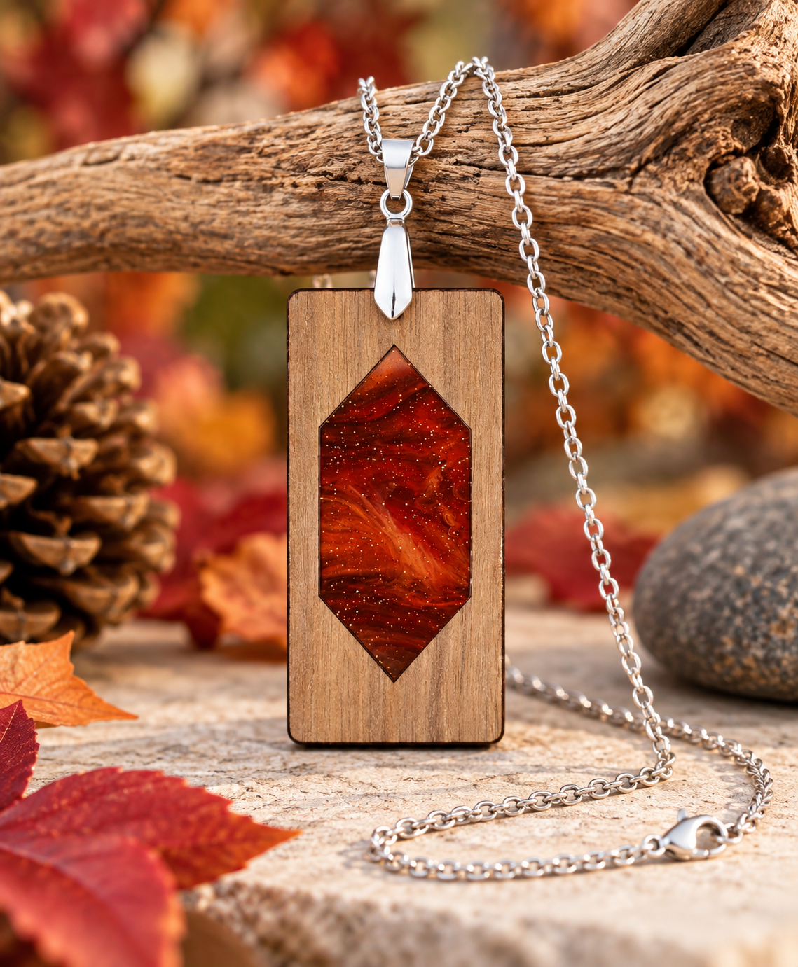 Autumn Ember walnut and red amber patterned acrylic pendant necklace with silver-tone chain, handcrafted and laser cut in New Zealand by Dopey Dog NZ.