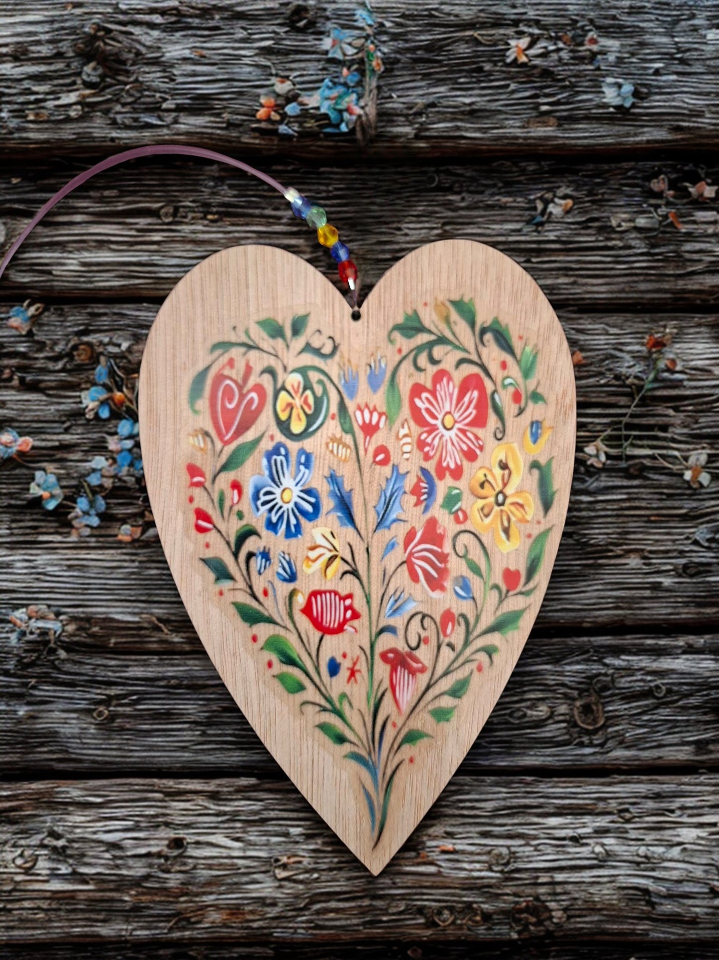 Hanging wooden heart with flowers