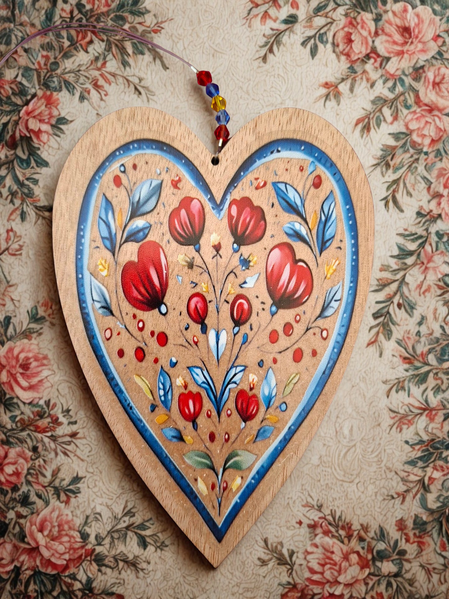 Hanging wooden heart with flowers