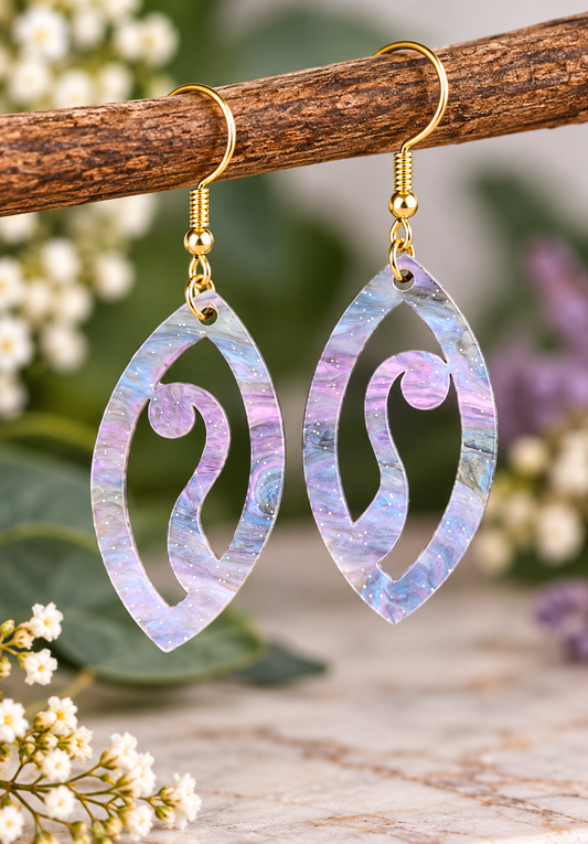 Pastel purple, blue and pearlescent acrylic statement earrings with swirl cut-out design and gold-tone hooks, laser cut and made in New Zealand by Dopey Dog NZ.
