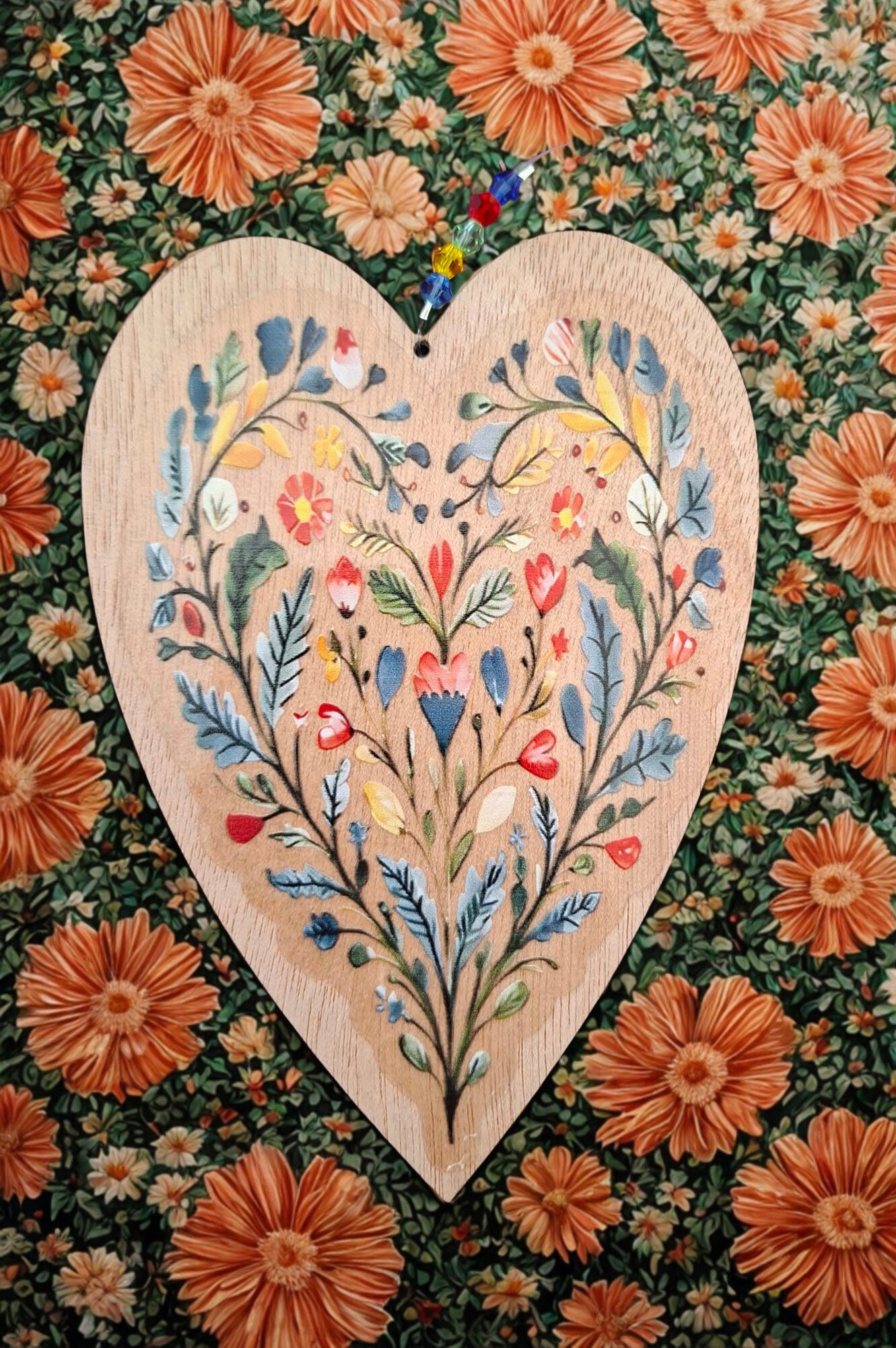 Hanging wooden heart with flowers