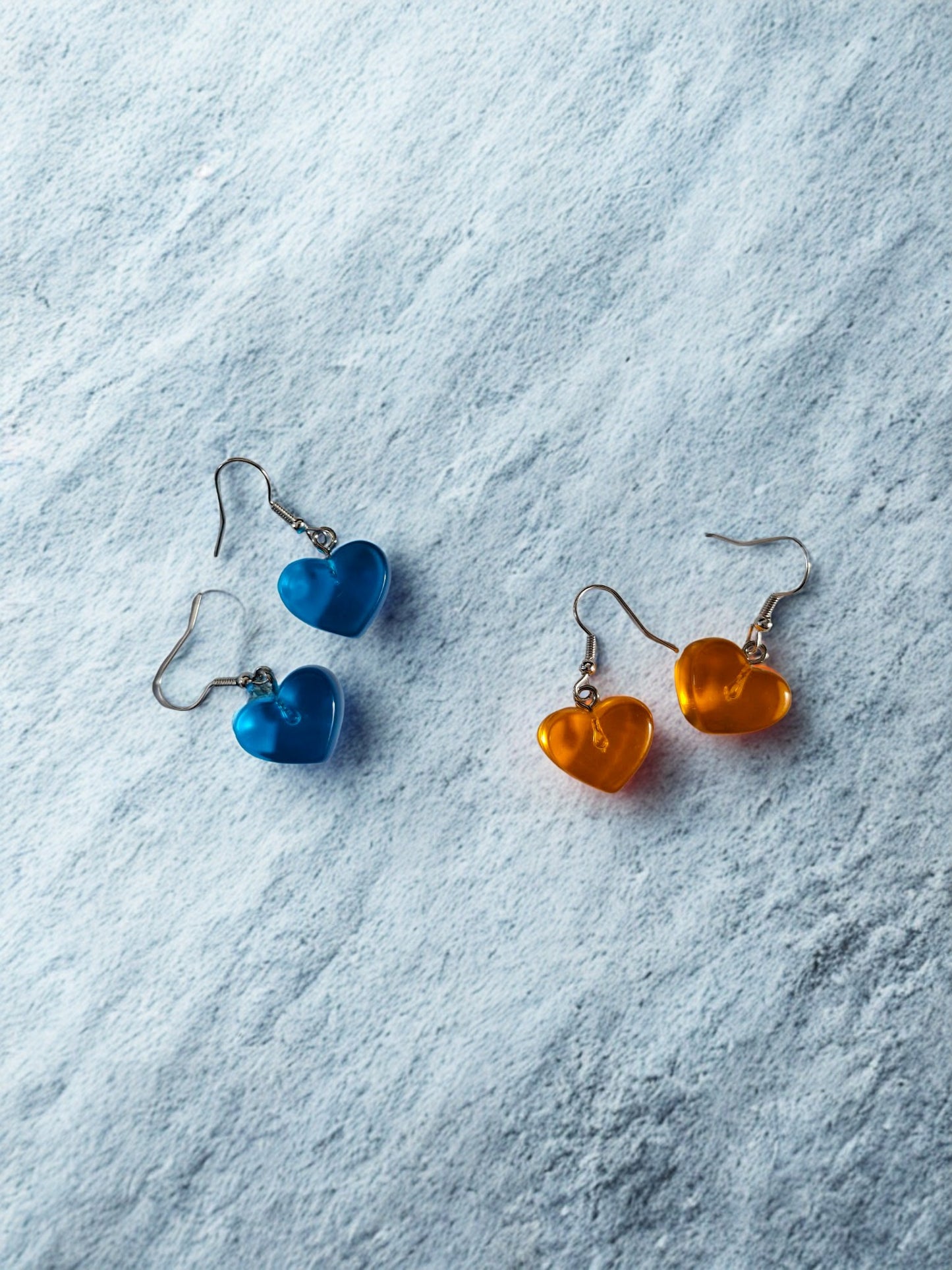 Bright orange or blue perspex hearts