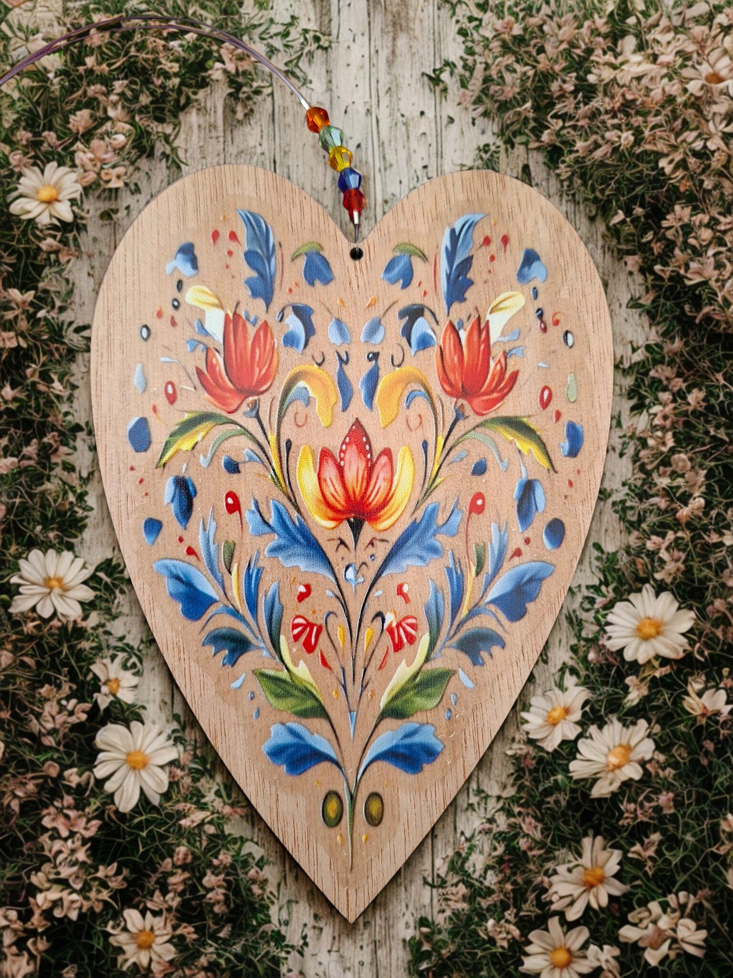 Hanging wooden heart with flowers