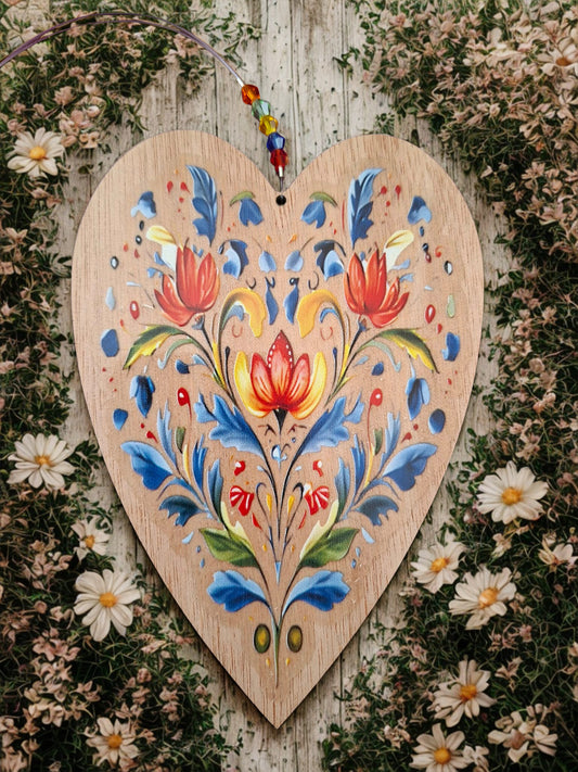Hanging wooden heart with flowers